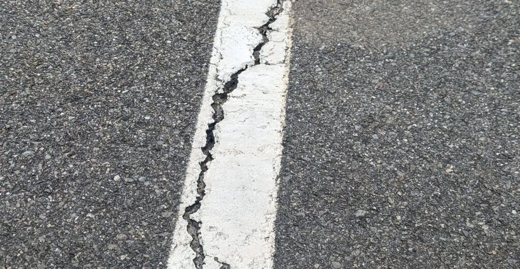 cracked white line road surface marking