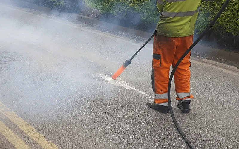 Line removal in progress on road surface