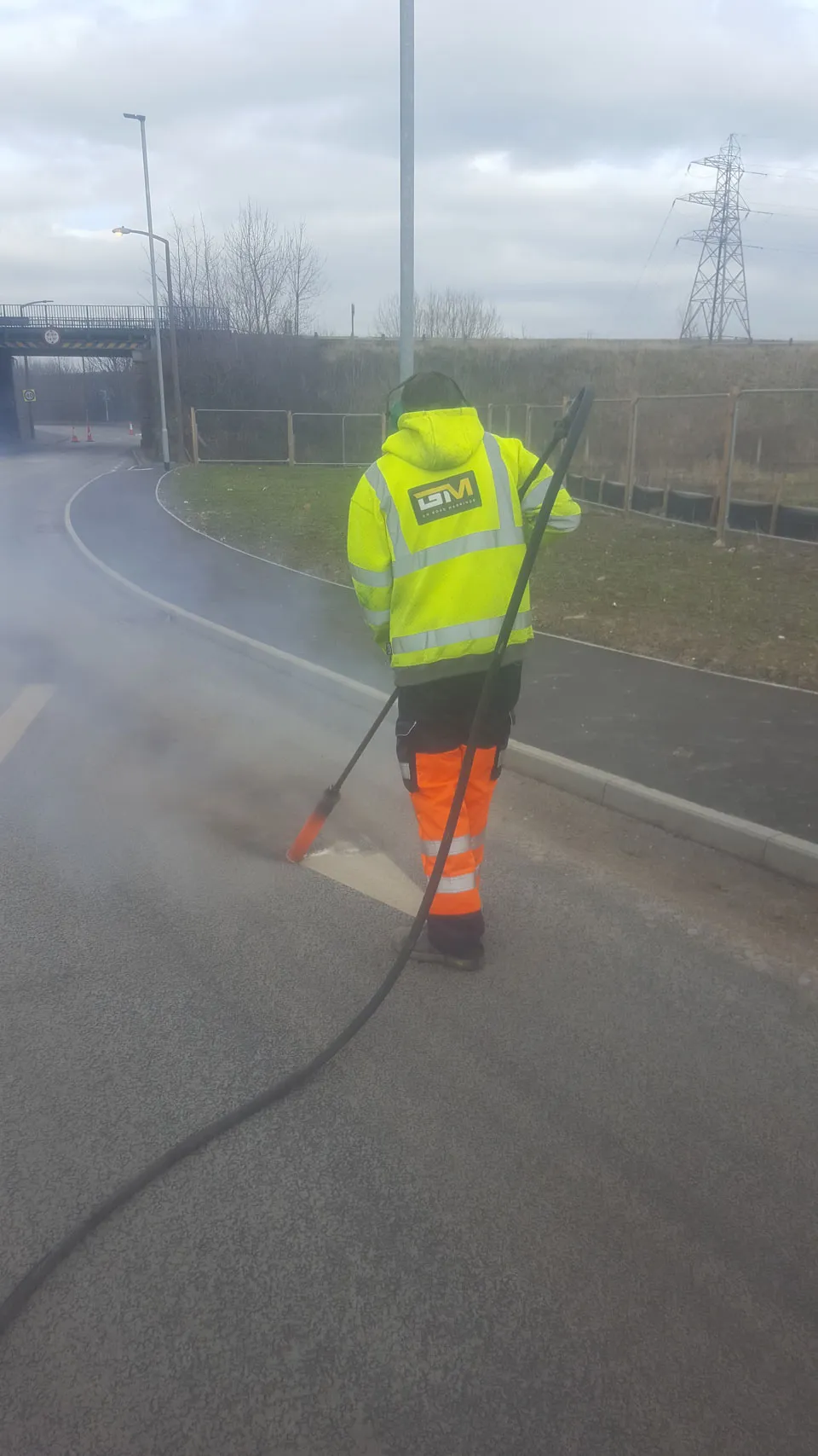 Before and after line removal on asphalt